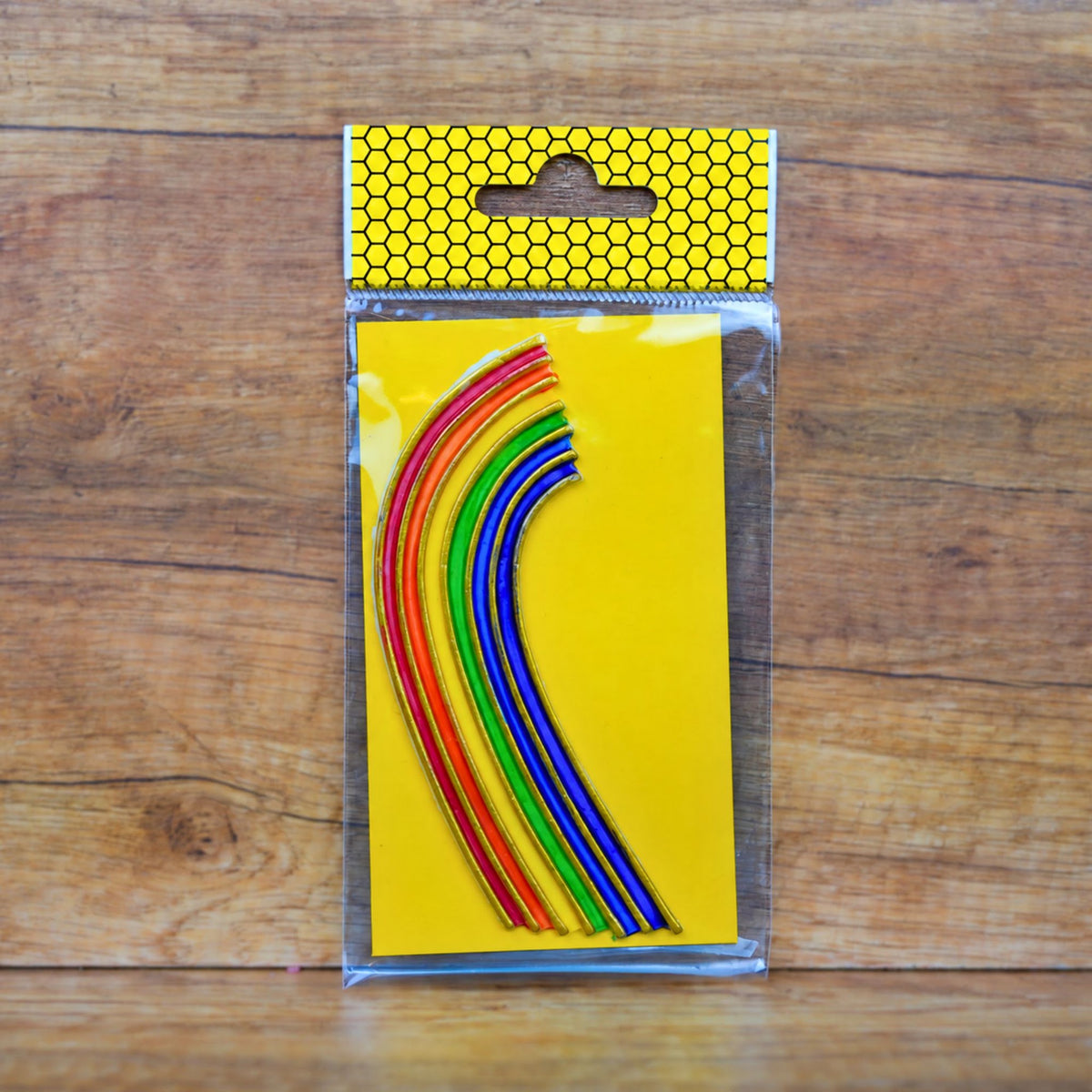 Buntes Wachsdekor Regenbogen mit Goldkontur, ca. 16 cm, auf Trägerpapier in der Verpackung